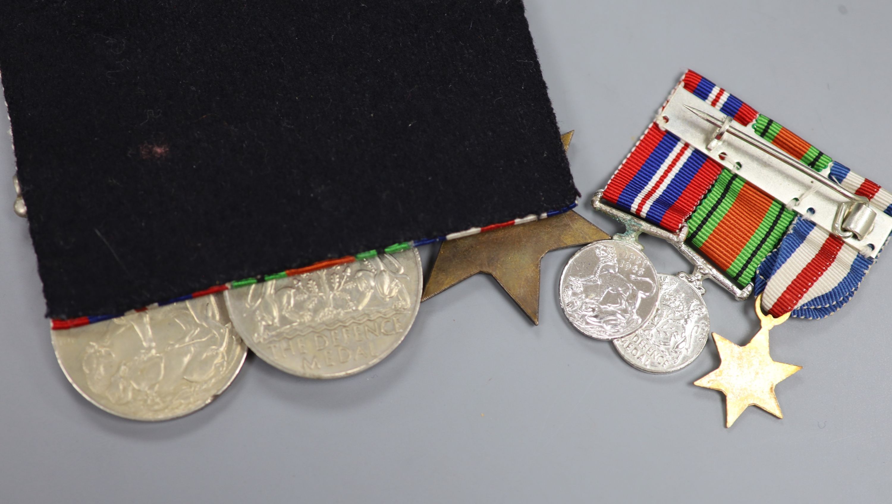 A WW2 trio of medals and matching miniatures, unnamed